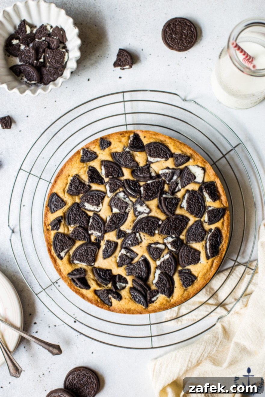 Layered Oreo Blondies with Golden Brown Edges A slice of Oreo Blondie revealing the distinct layers of cookie crust and blondie