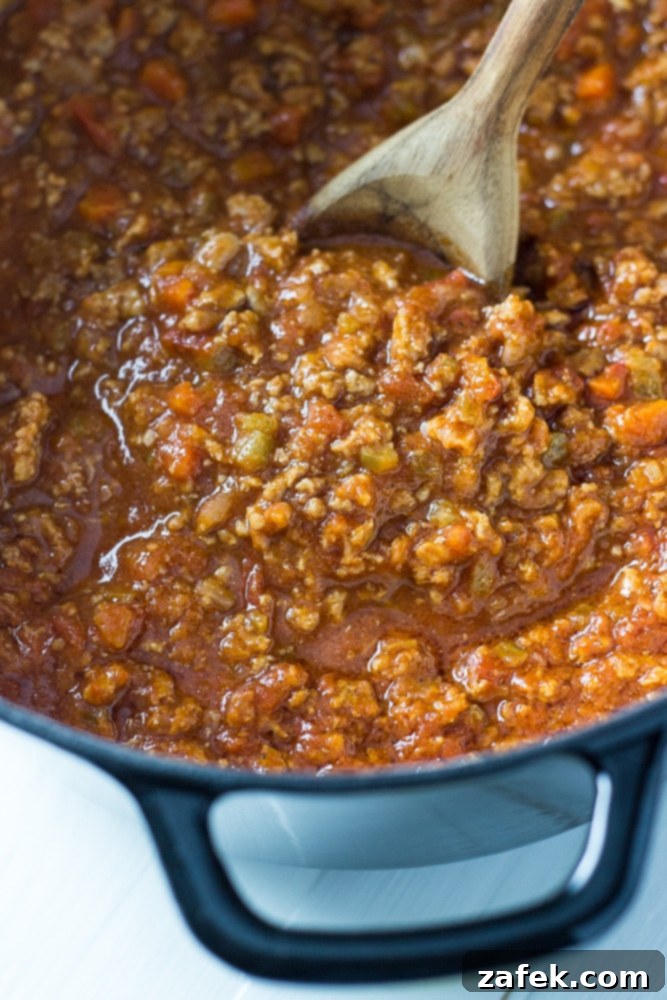Close-up of Bucatini Bolognese with sauce clinging to the pasta