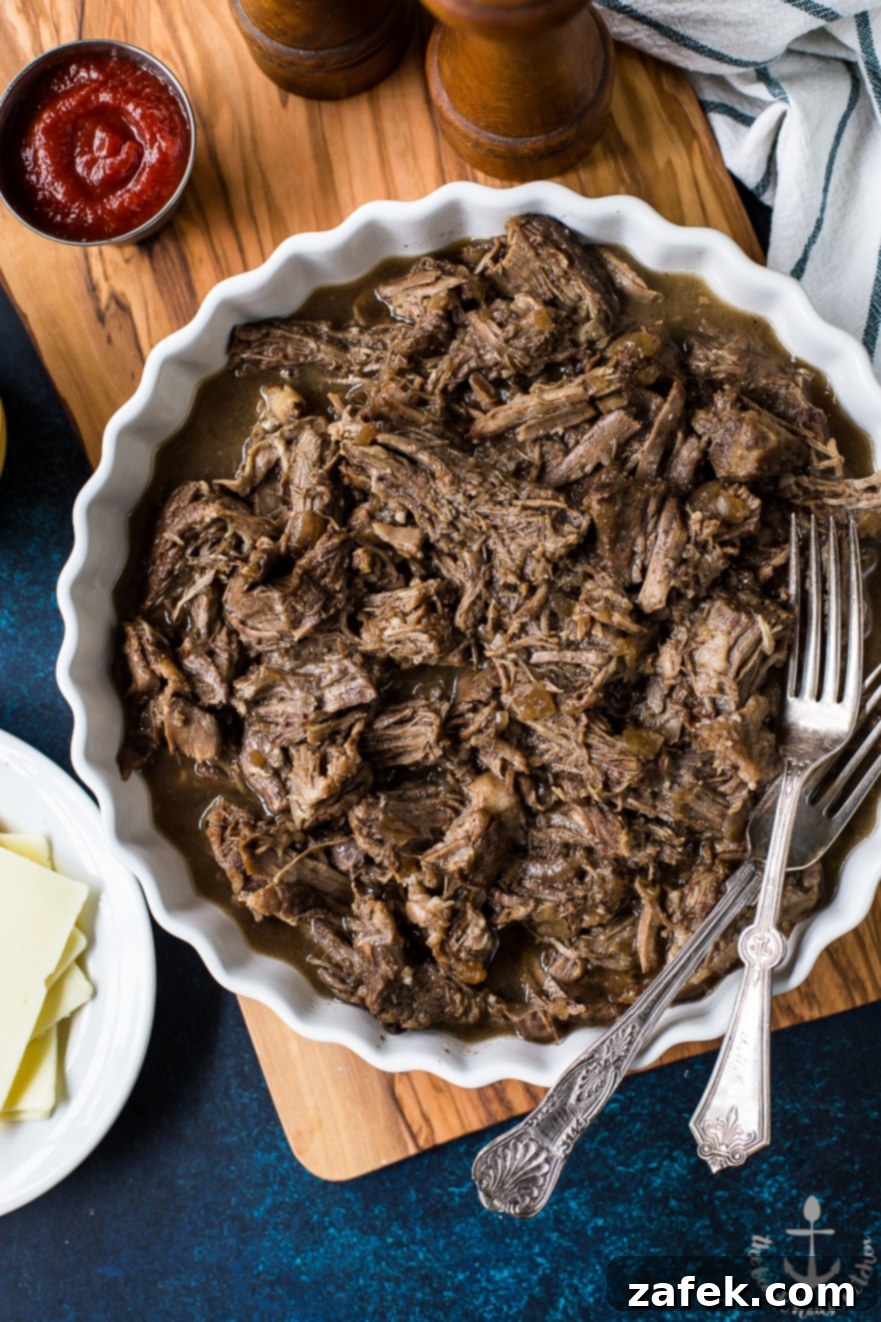 Philly French Dip Sandwiches with Peppers, Onions and Land O'Lakes Deli American Cheese Raw beef chuck roast seasoned and seared in a Dutch oven, ready for slow roasting to become tender French Dip meat.