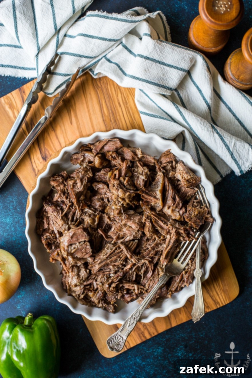Baked Philly French Dip Sandwiches with Melted Cheese Philly French Dip Sandwiches arranged on a baking sheet, with melted Land O'Lakes Deli American cheese, ready to be served as game day comfort food.