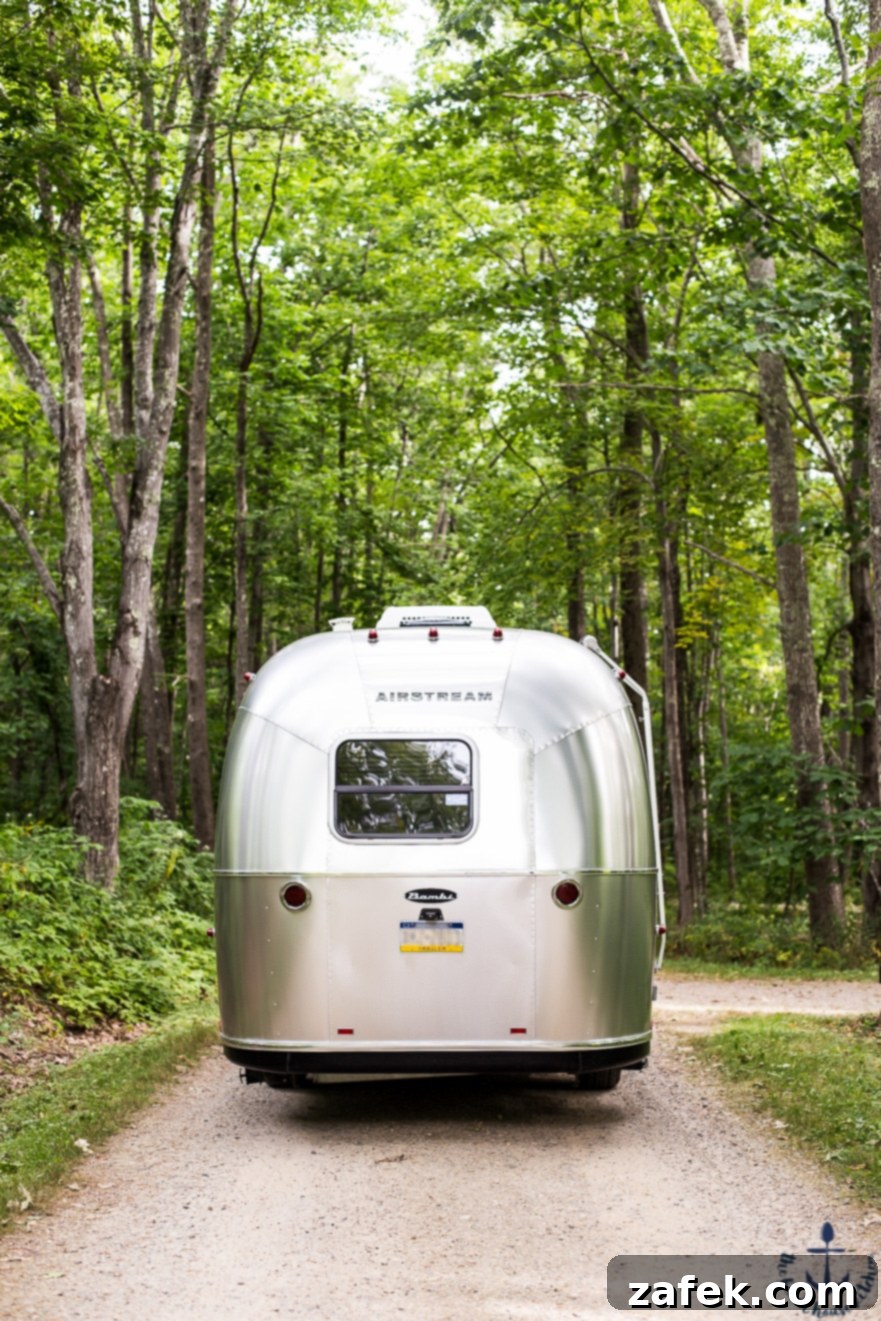 Airstream camper nestled in a picturesque campground in Maine