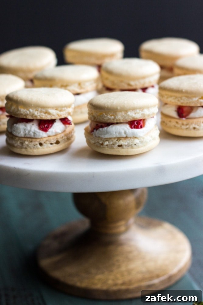 Strawberry Shortcake Macaron Dreams 4 Fantastic closeup of Strawberry Shortcake Macarons served on a white tray on a stand