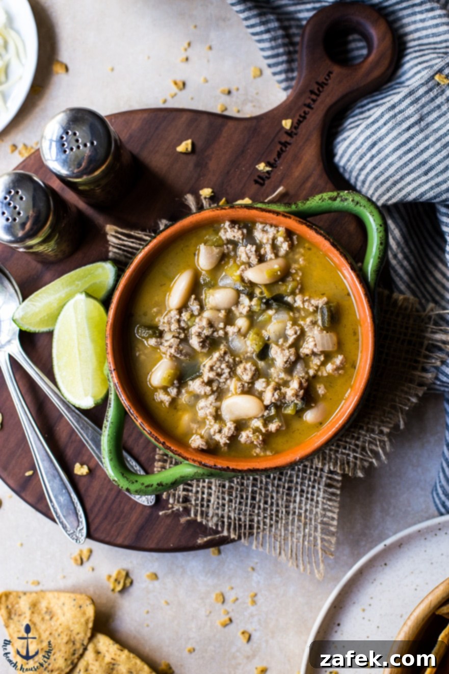 Up close overhead photo of a bowl of White Bean Turkey Chili