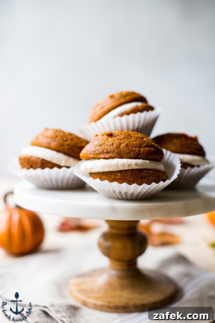 Pumpkin Whoopie Pies with Maple Buttercream Whoopie pies on a cake stand