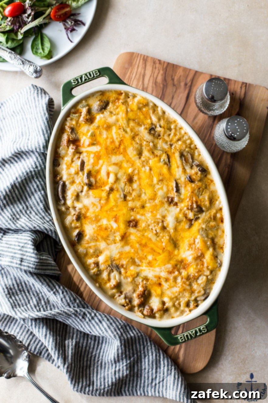Cheesy Spicy Sausage Rice Bake - A comforting and hearty meal with spicy sausage, rice, and cheese