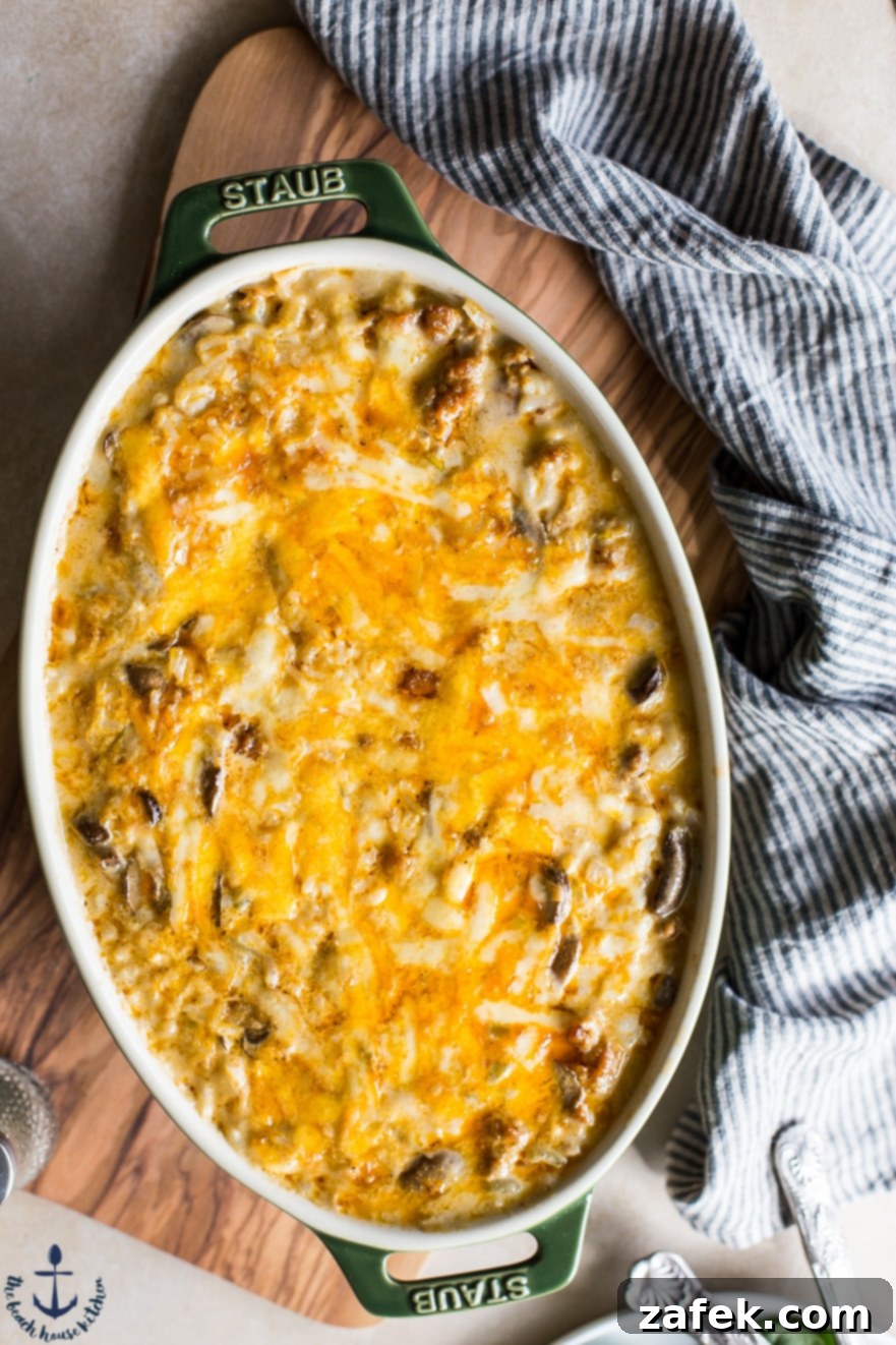 Closeup of Cheesy Spicy Sausage Rice Bake, showing texture and melted cheese