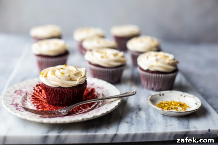 Close-Up of Red Velvet Cupcake with Cream Cheese Frosting Close-up of a Red Velvet Cupcake with a swirl of Cream Cheese Frosting, showing its moist texture