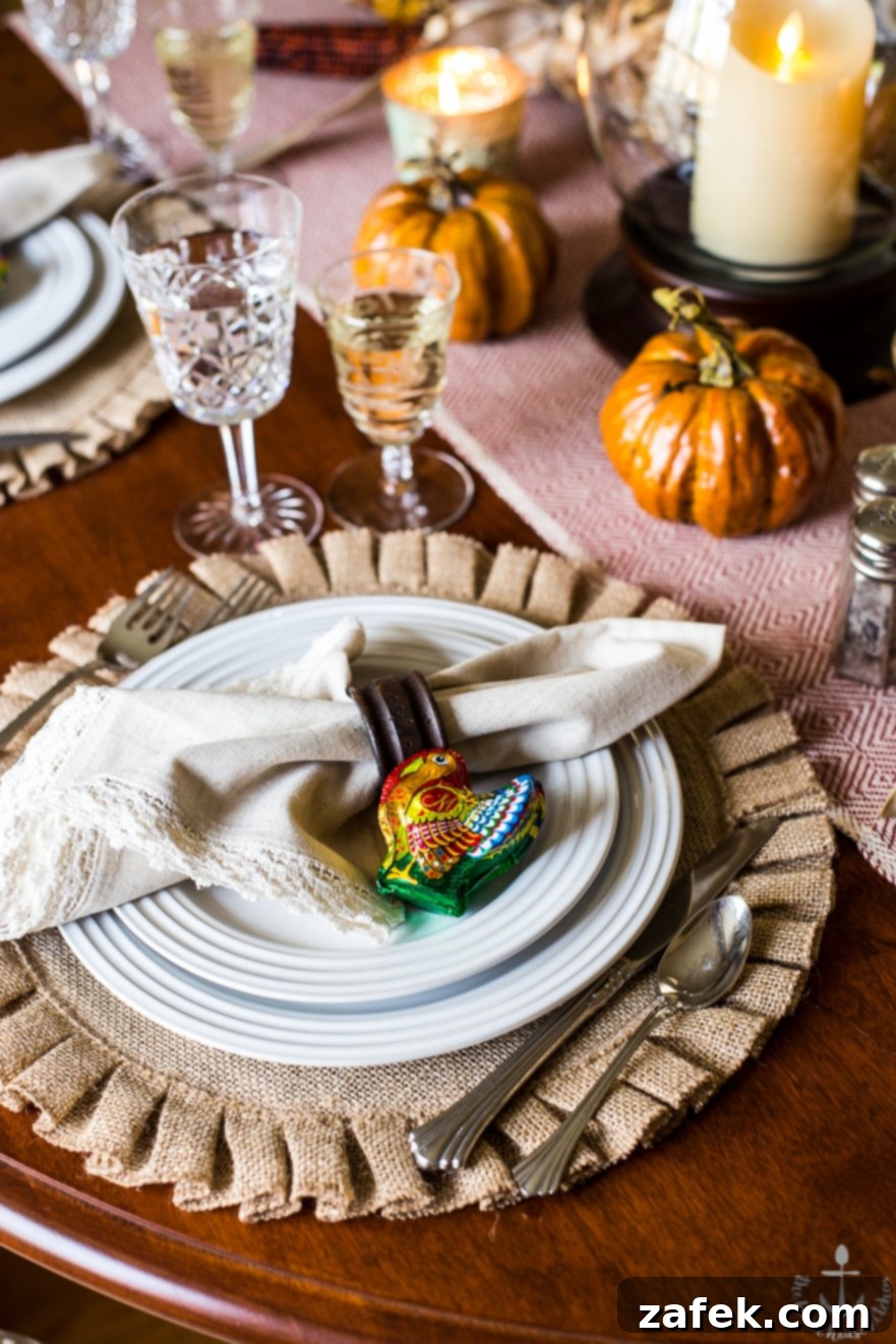 Thanksgiving table with elegant settings and butternut squash soup