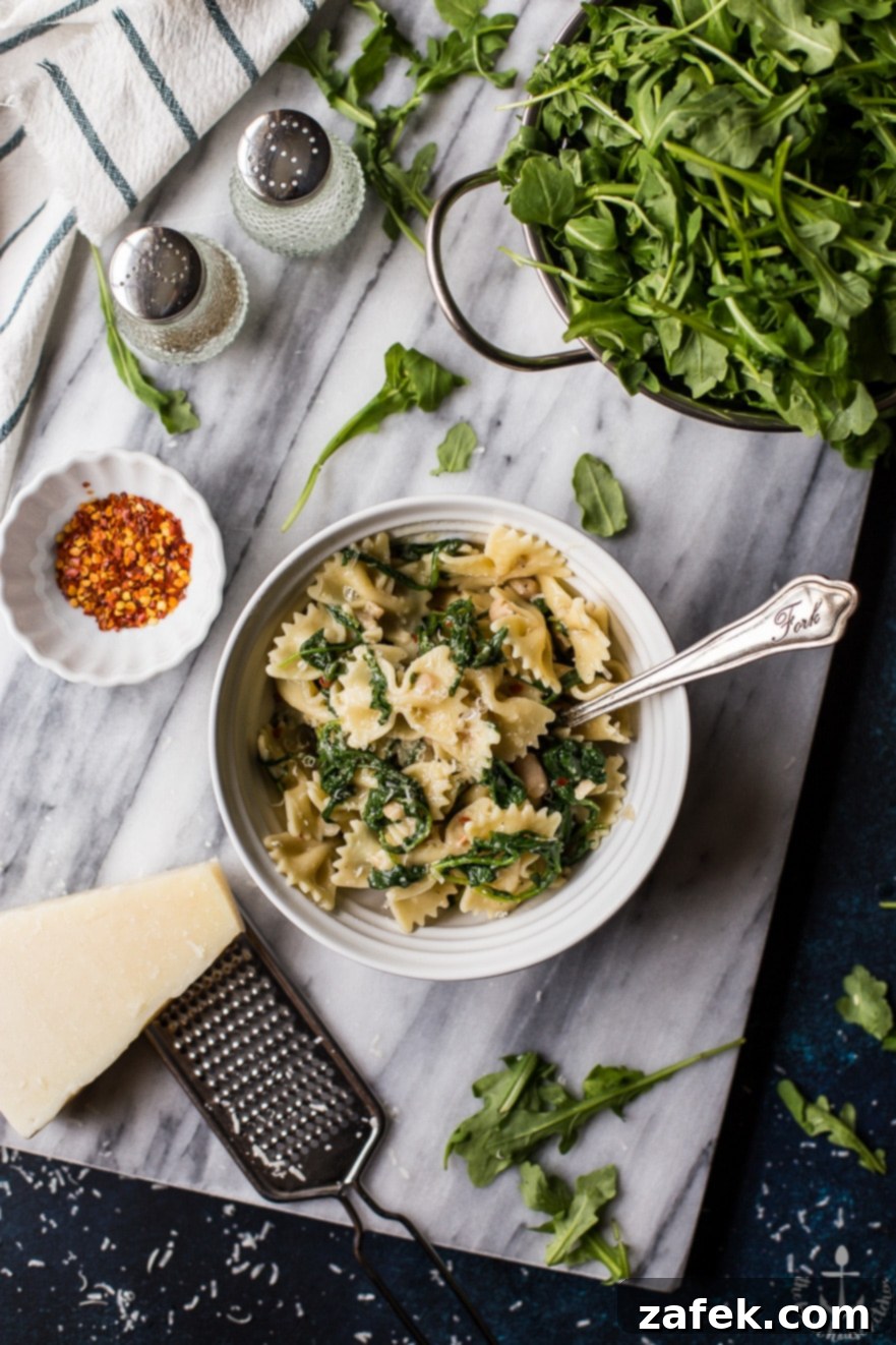 Close-up of Pasta with White Beans and Arugula in a bowl