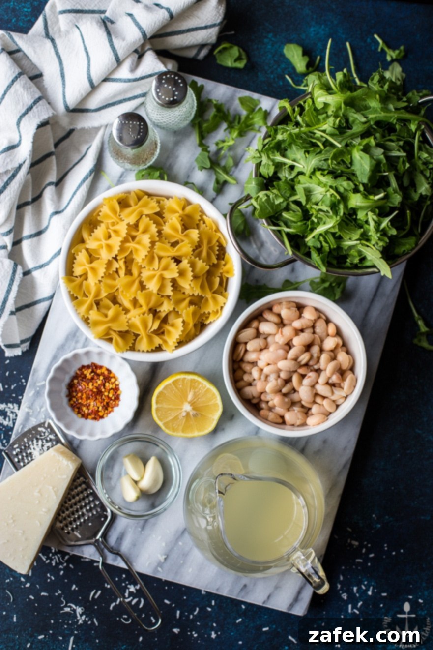 A serving of Pasta with White Beans and Arugula on a plate
