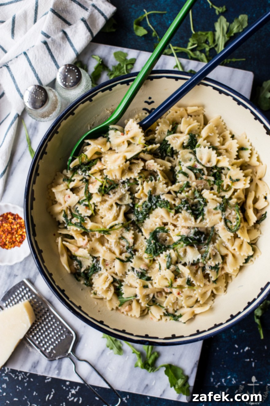 Another perspective of Pasta with White Beans and Arugula in a serving bowl
