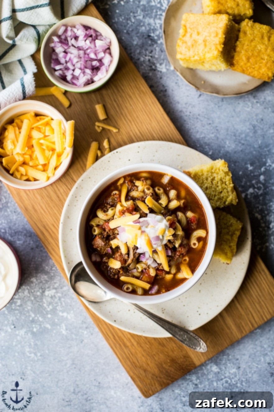 Flavorful Chili Mac Ingredients Close-up of Uncle John's Chili Mac, showcasing tender beef chunks and macaroni noodles.