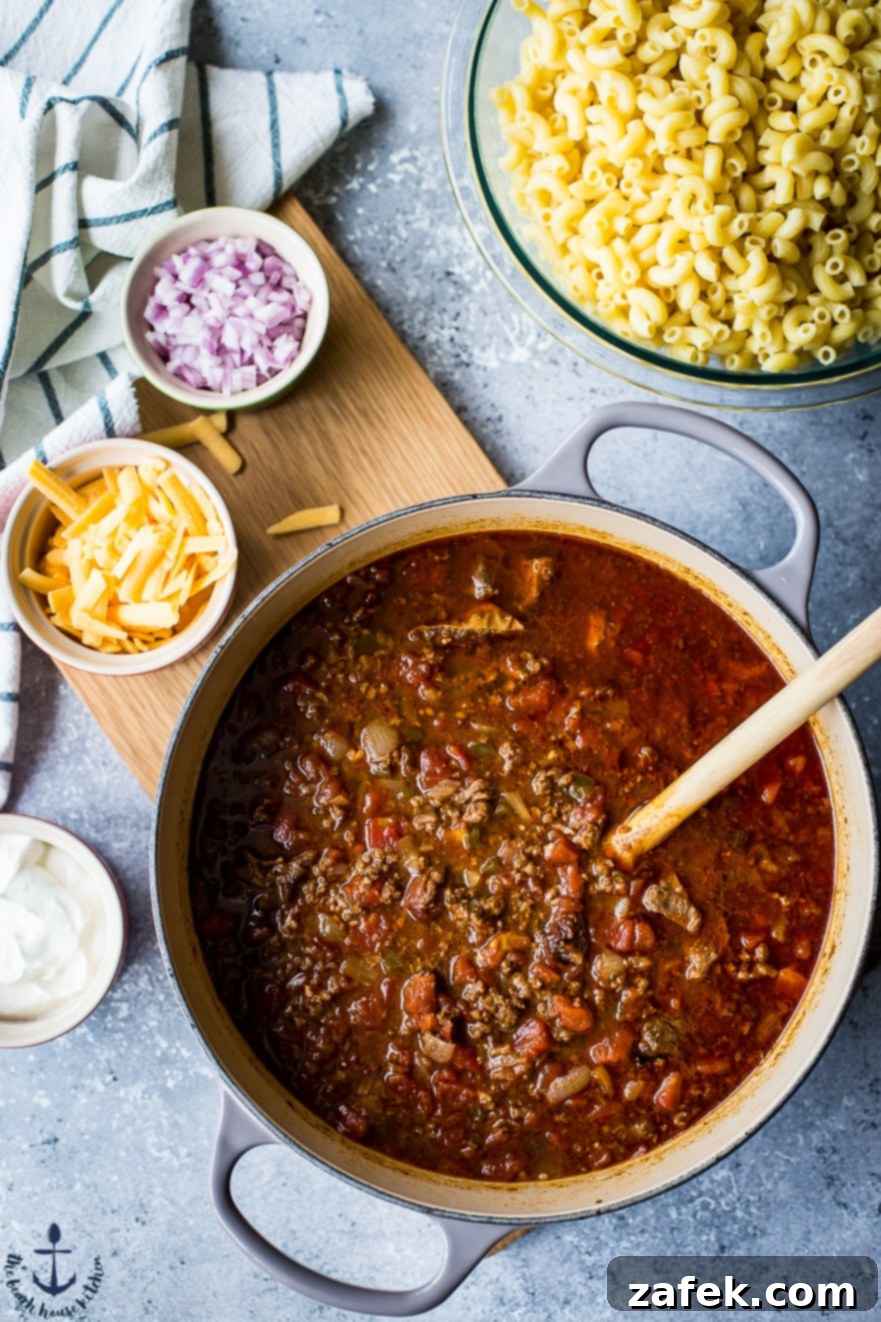 Chili Mac Spice Blend Close-up of the spiced ground beef and vegetables cooking in a pot for chili mac.