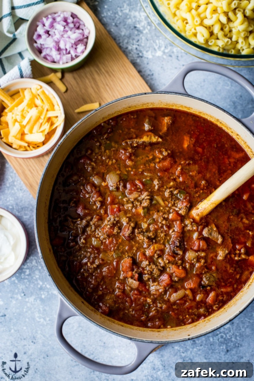 Chili Mac with Cornbread A serving of Uncle John's Chili Mac with a side of golden cornbread.