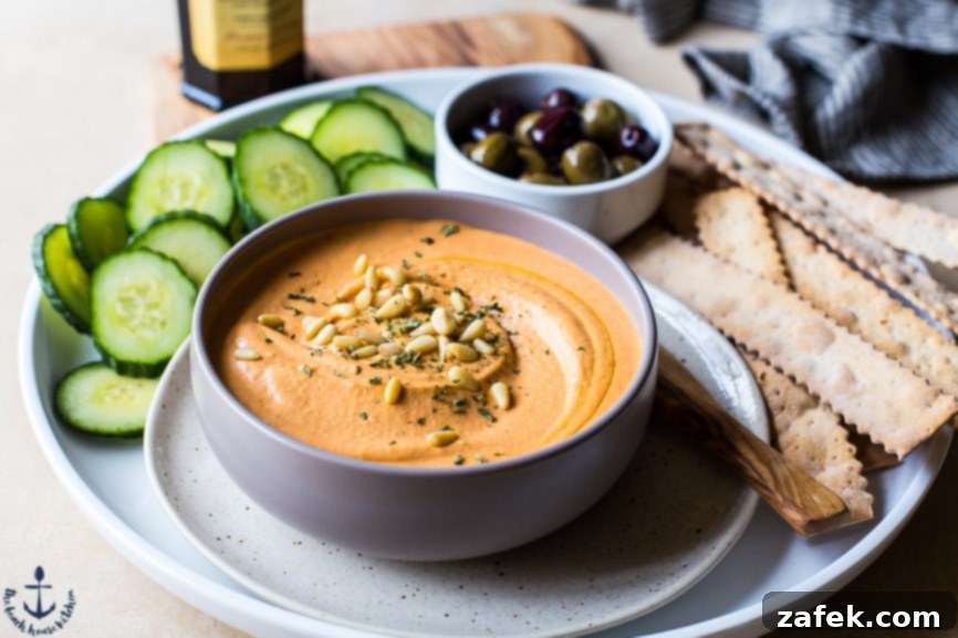 Creamy White Bean Roasted Red Pepper Hummus in a bowl, ready to serve.