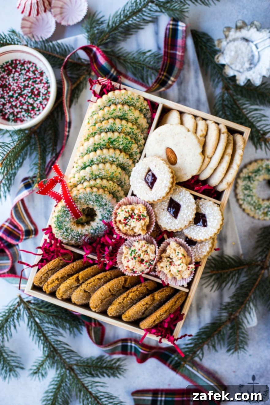 A festive holiday cookie box, showcasing a generous array of various homemade cookies and treats.