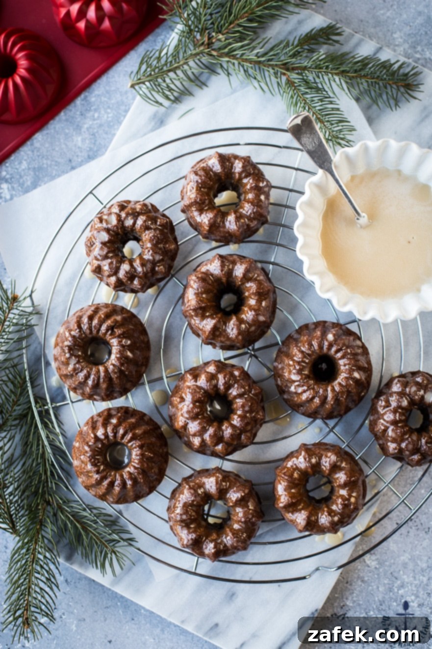 Collection of Mini Gingerbread Bundt Cakes with a dusting of cinnamon and maple glaze