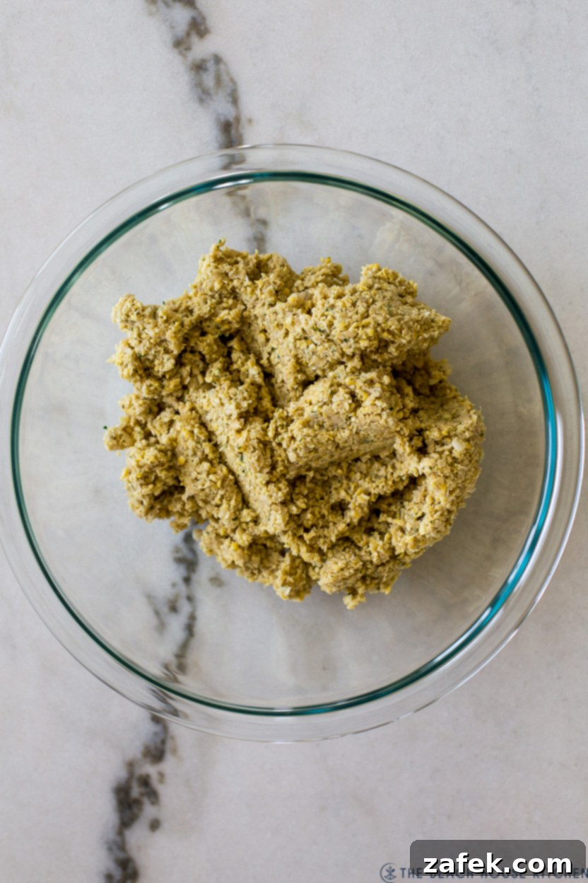 Overhead photo of falafel filling mixture in a glass bowl