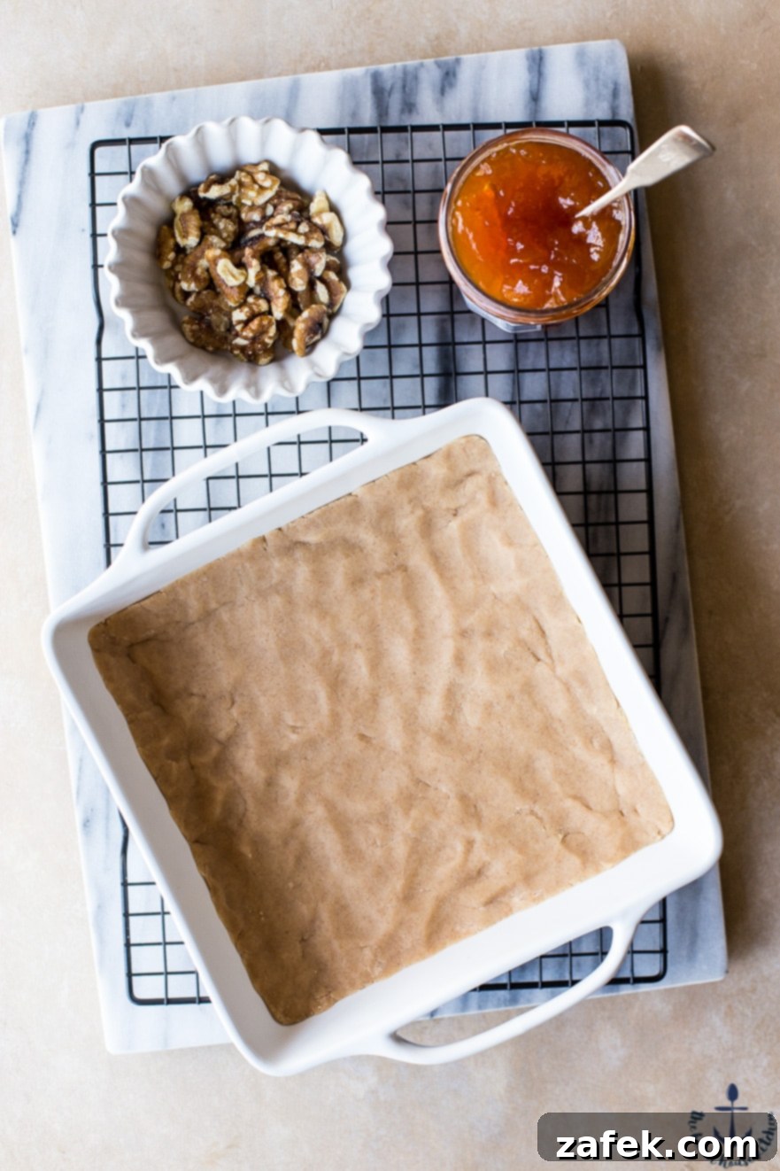 Apricot Walnut Streusel Bars Stack of Apricot Walnut Streusel Bars with a bite taken