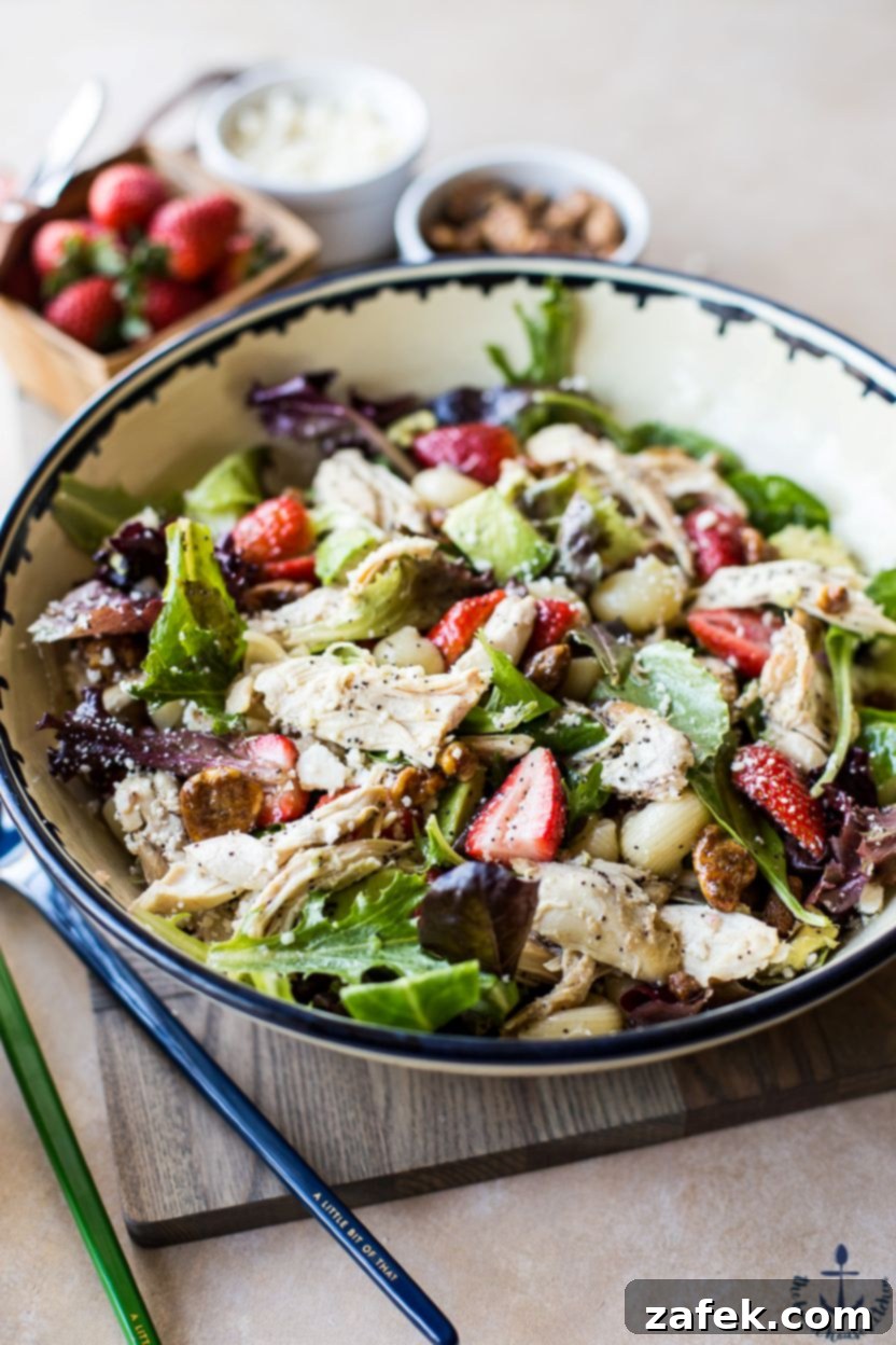 Overhead shot of Chicken Strawberry Avocado Pasta Salad, showcasing its colorful presentation and inviting texture.