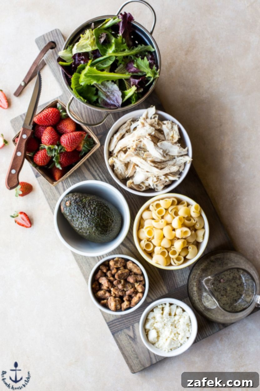 A bowl of fresh spring mix lettuce, ready to be combined with other ingredients for the pasta salad.