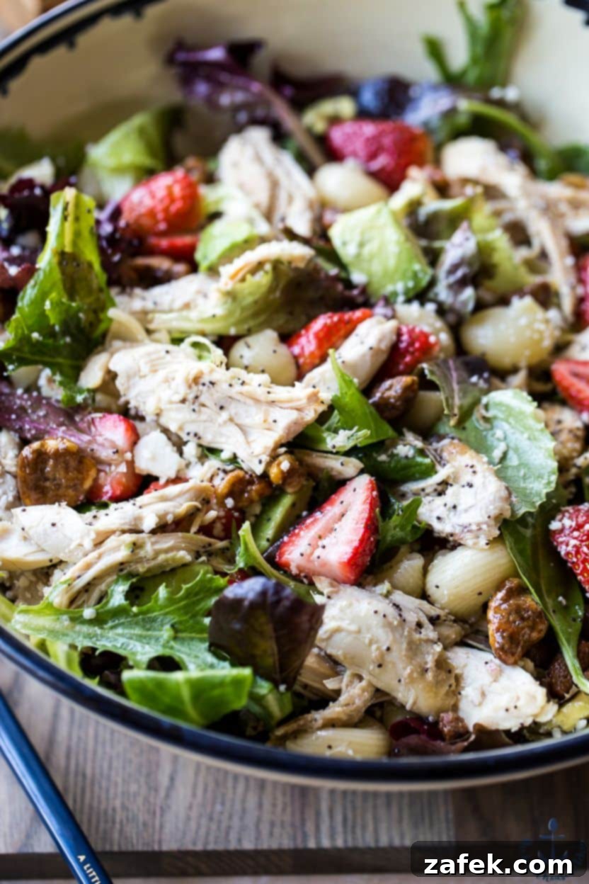Freshly sliced strawberries, ready to be added to the summer pasta salad.