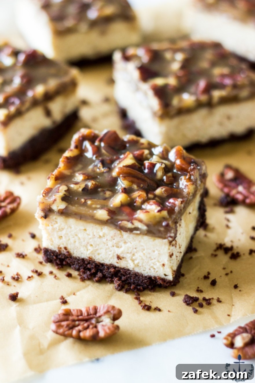 Rich Cheesecake Bars adorned with a crunchy Pecan Praline Topping