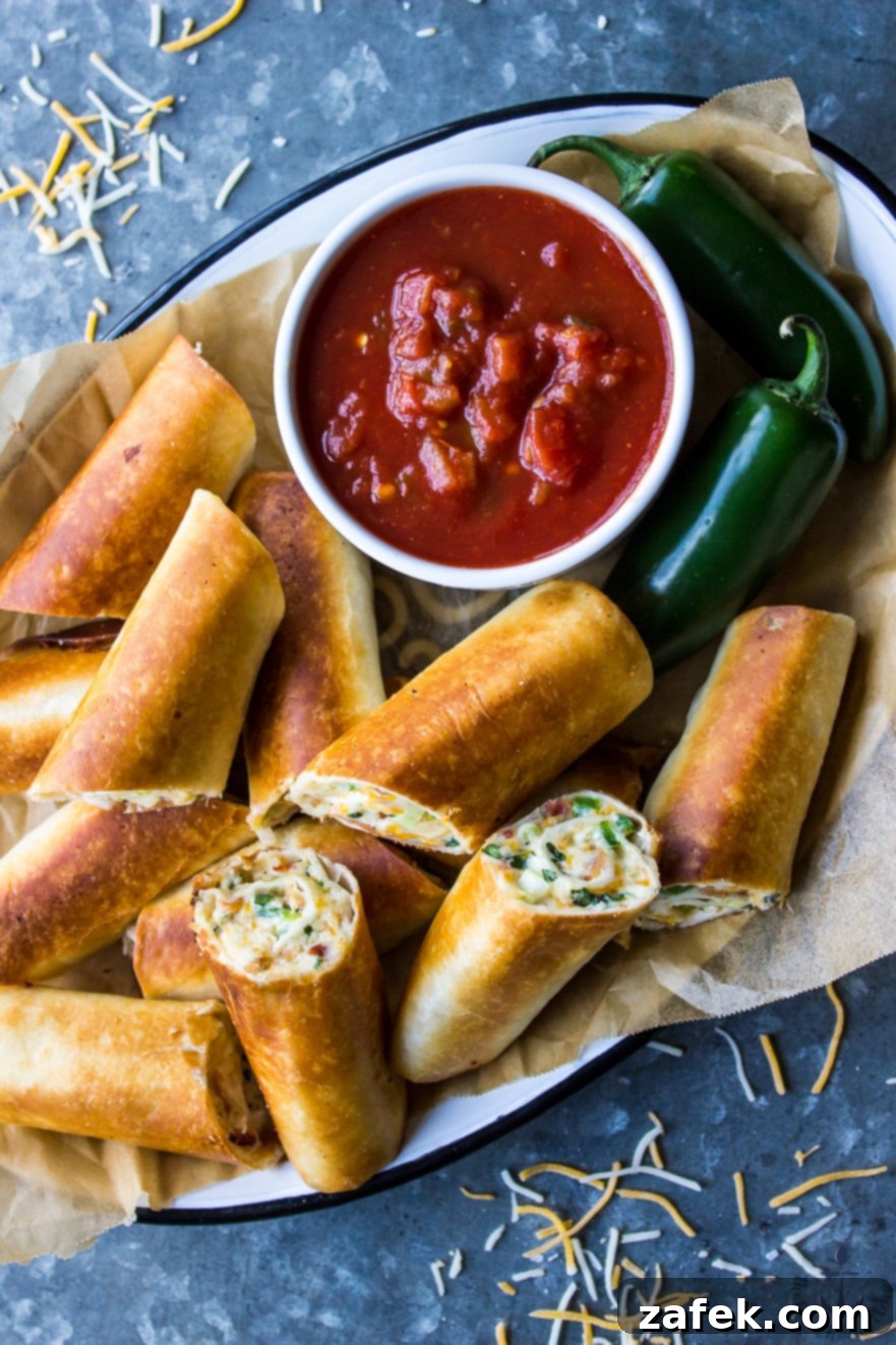 Crispy Cheesy Bacon Jalapeño Taquitos served with dipping sauce