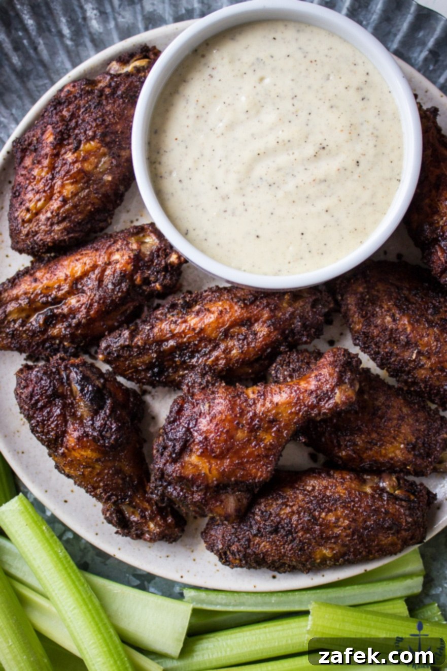 Crispy Baked Spicy Dry Rub Wings with a side of creamy White BBQ Sauce
