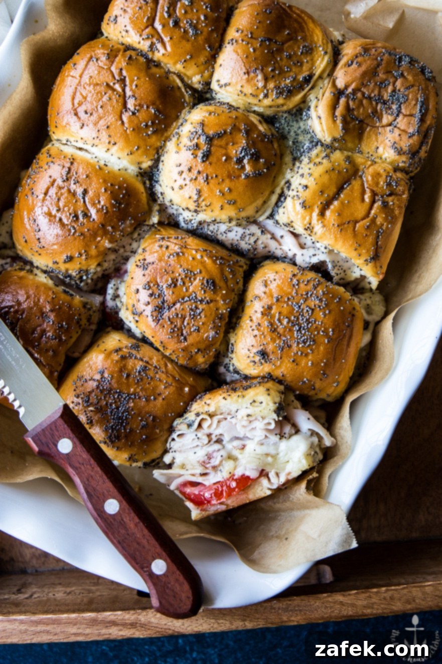 Mini Kentucky Hot Brown Sliders with turkey, bacon, and mornay sauce