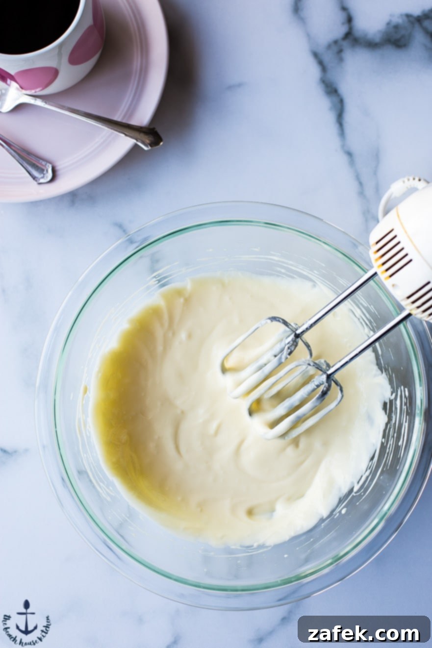 Black Bottom Delights 3 Prepared cupcake batter and cream cheese filling, ready for assembly.