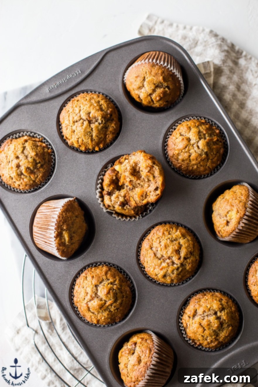 Sunrise Harvest Muffins 5 Another overhead shot of Morning Glory Muffins in a baking tin, ready to be enjoyed.
