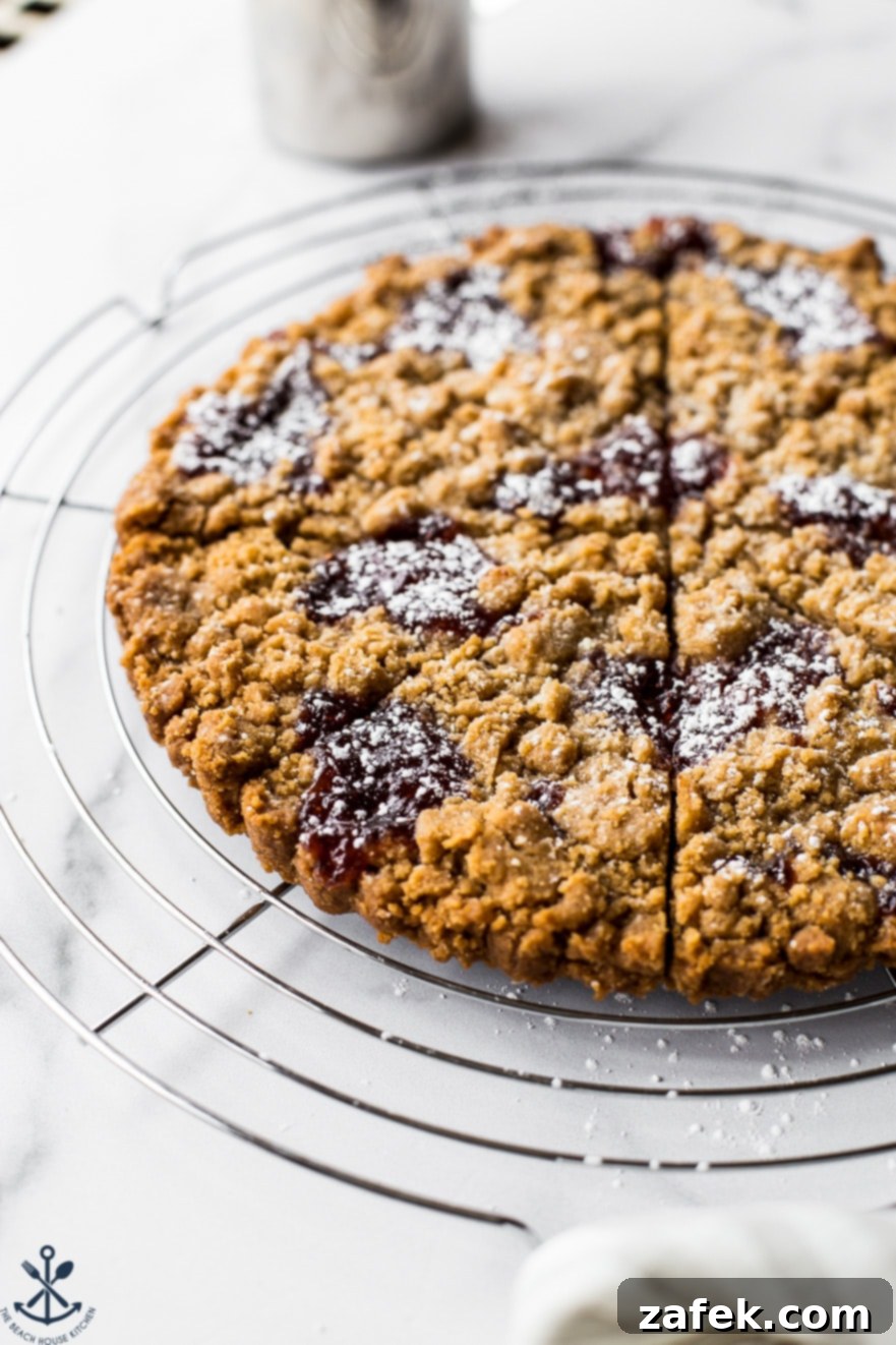 Strawberry Jam Crumb Cookies on a round wire rack looking absolutely inviting and delicious