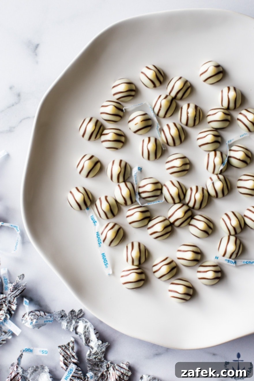 Hershey's Hug Brownie Bites Overhead photo of Hershey's Hug Candies on a white plate, ready to be added to the brownie bites.