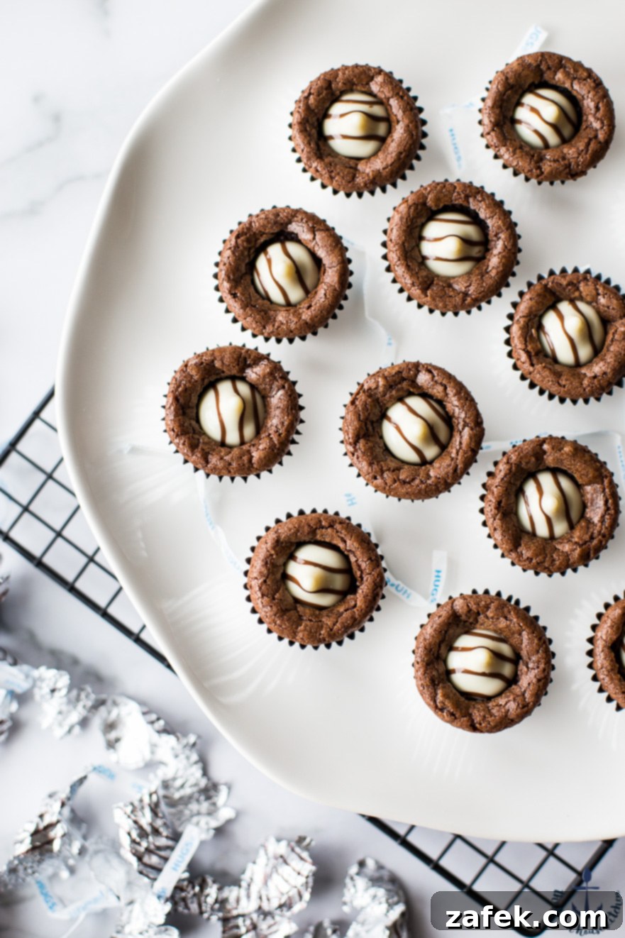 Hershey's Hug Brownie Bites Overhead photo of Hershey's Hug Brownie Bites arranged neatly on a white plate, ready for serving.