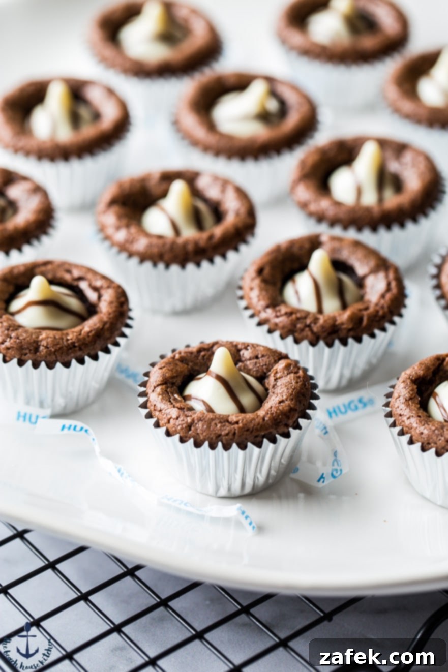 Hershey's Hug Brownie Bites Hershey's Hug Brownie Bites on a white plate, with a close-up showing the melted chocolate center.