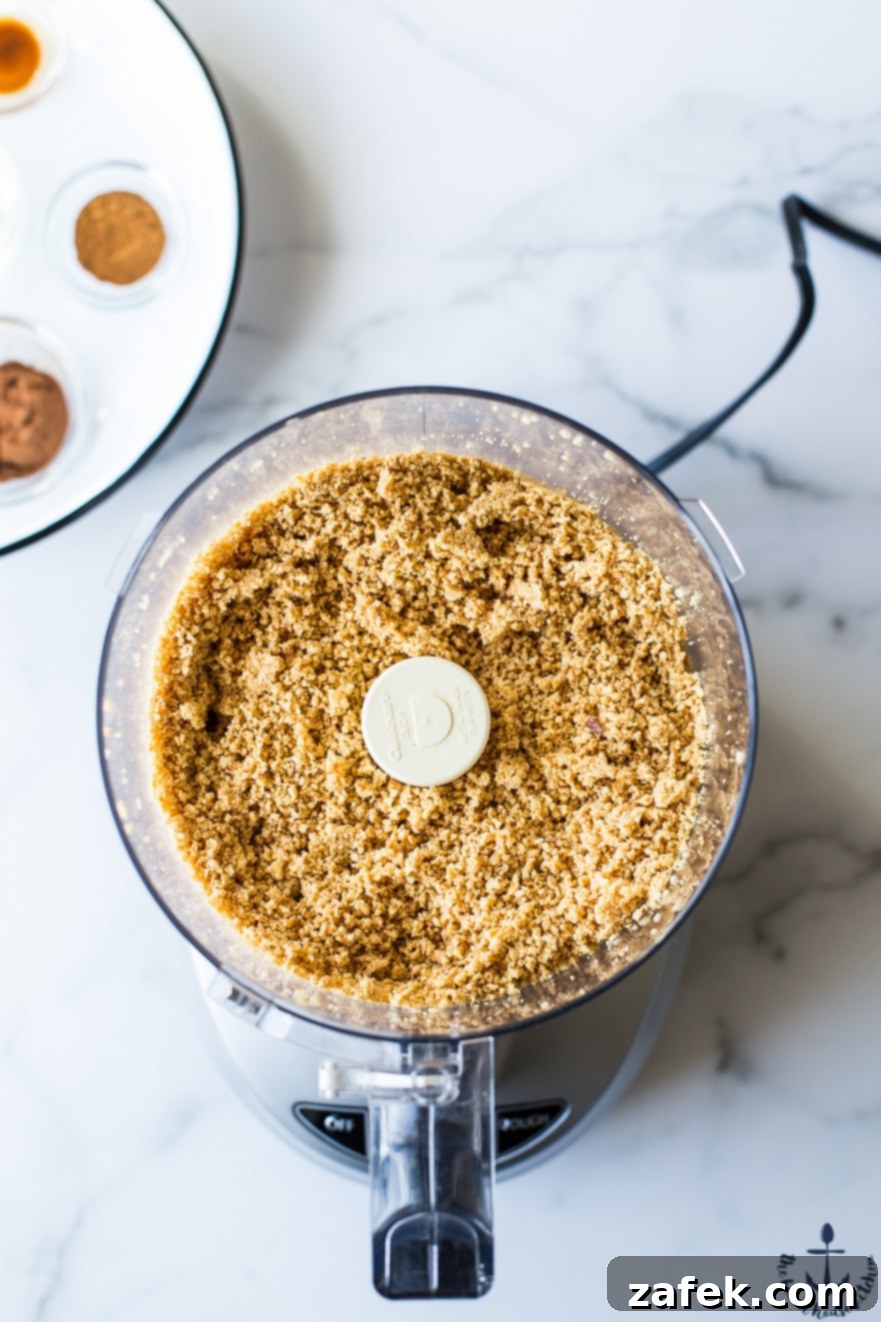 Barista Blend Peanut Butter 5 Close-up overhead shot of dry roasted peanuts being processed in a food processor, beginning their transformation into creamy peanut butter.