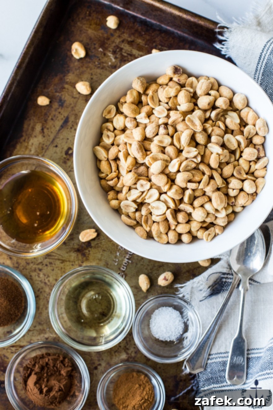 Barista Blend Peanut Butter 6 Overhead shot of all the individual ingredients for making Cappuccino Peanut Butter, meticulously arranged in small bowls on a textured cookie sheet, awaiting preparation.