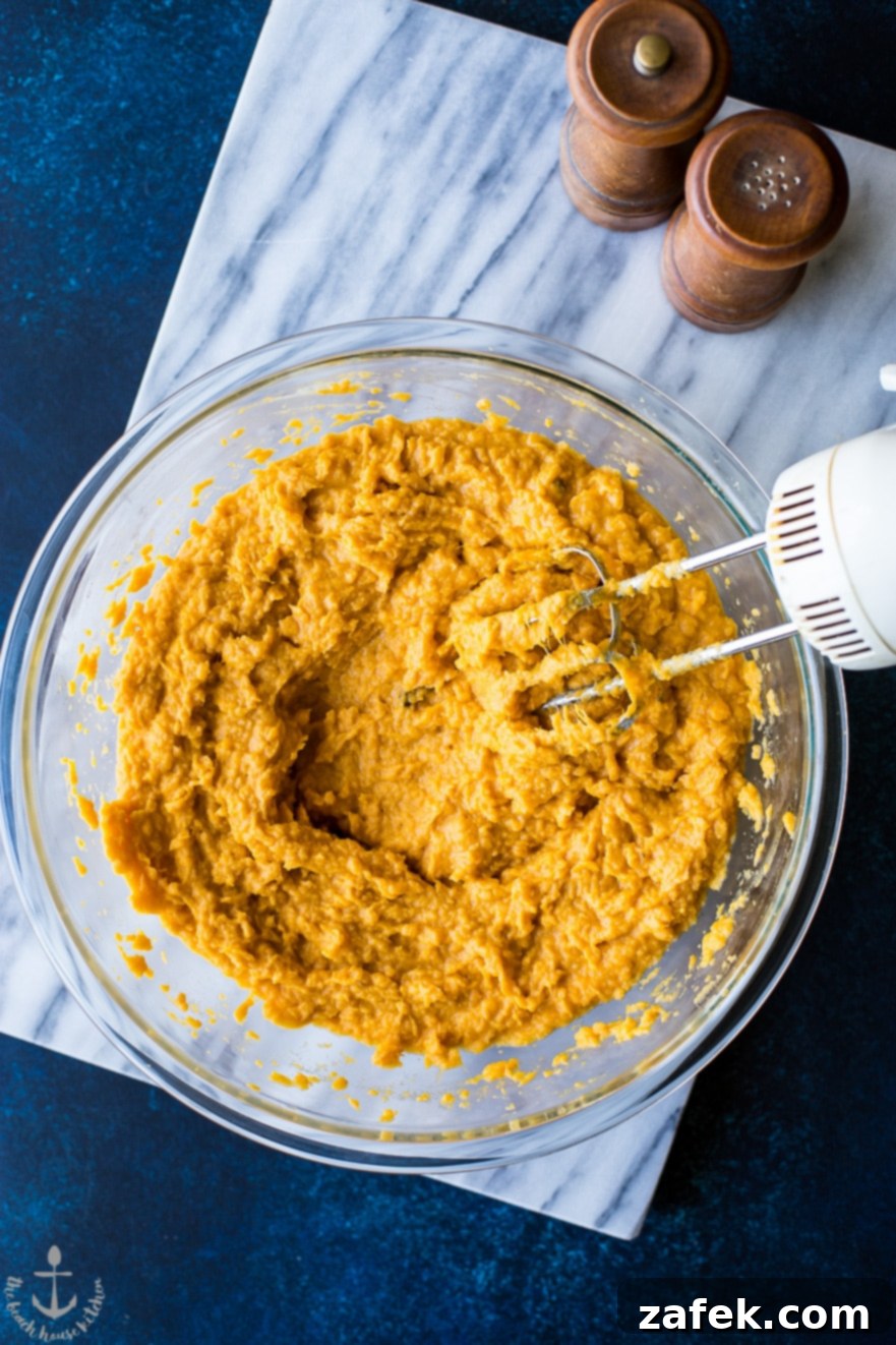 Heavenly Sweet Potato Mash with Prosciutto Crunch 3 Mashed sweet potatoes in a rustic glass bowl, ready for crispy prosciutto topping