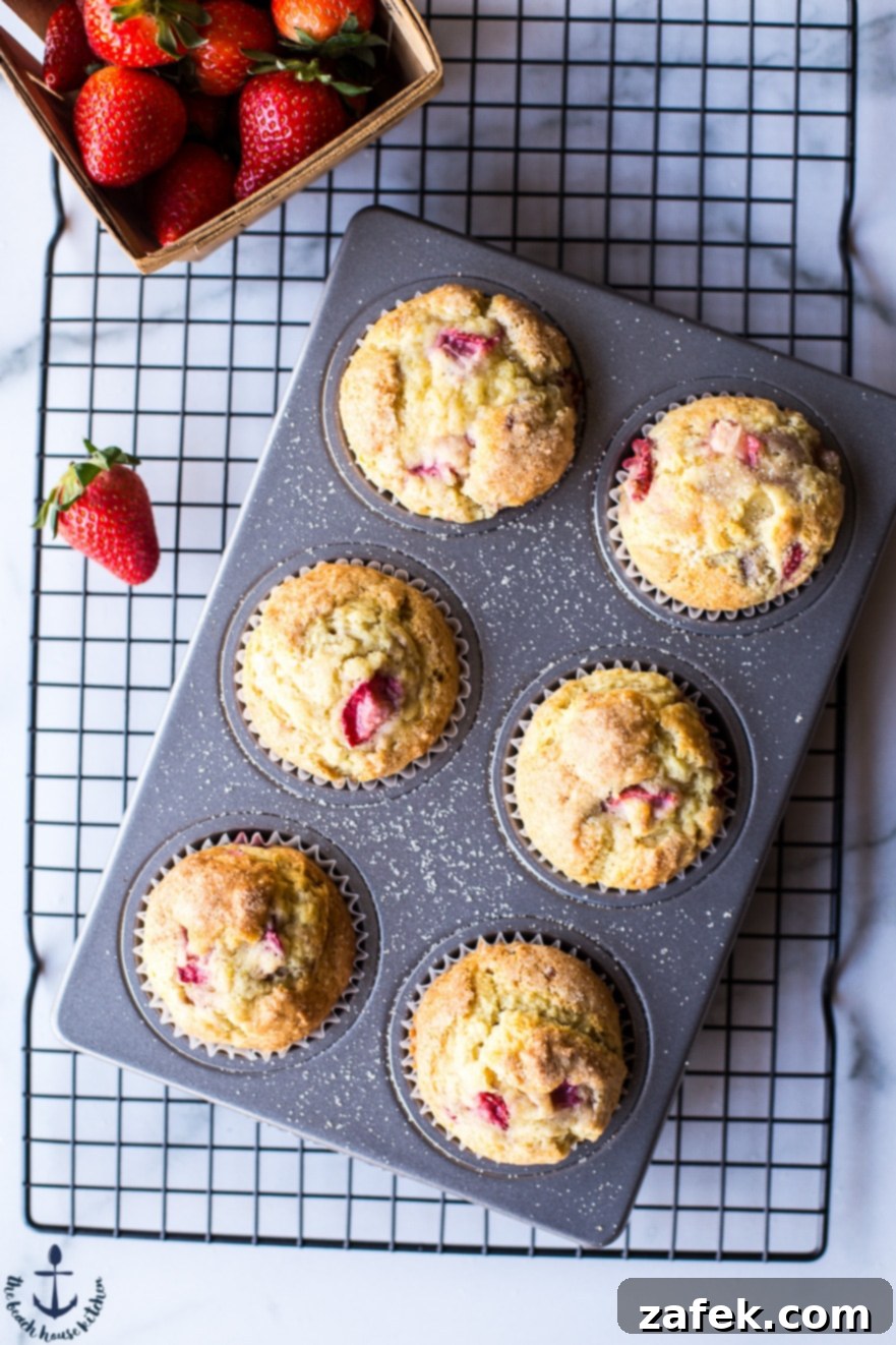Sunshine Strawberry Lemon Muffins 7 A final overhead shot of the strawberry lemon muffins in the pan, ready to be served, emphasizing their perfect golden crust and inviting texture.