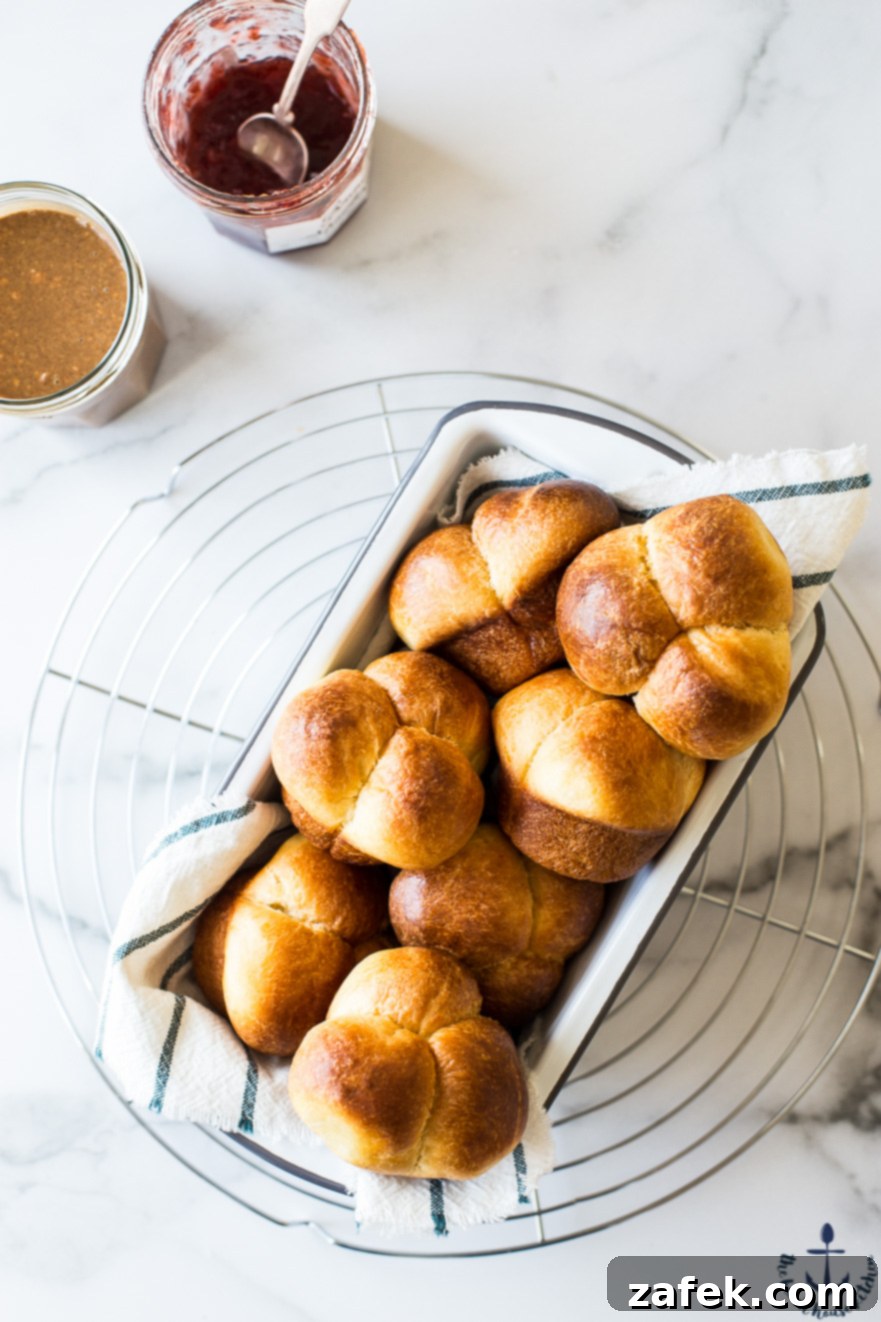 Puffy Brioche Buns 2 Golden brown Bubble-Top Brioche Rolls baking in a loaf pan, ready to be served.