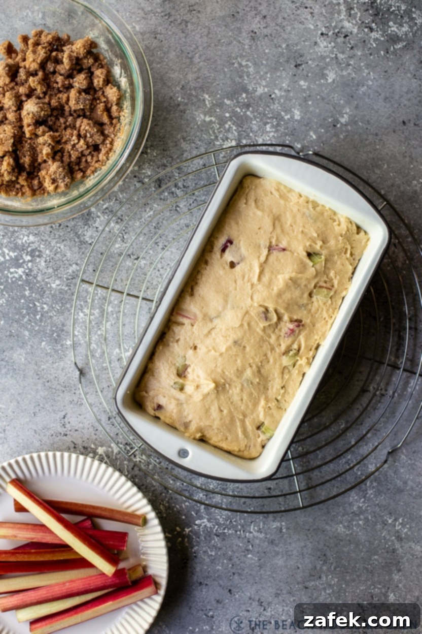Overhead photo of a pre-baked rhubarb crumb loaf