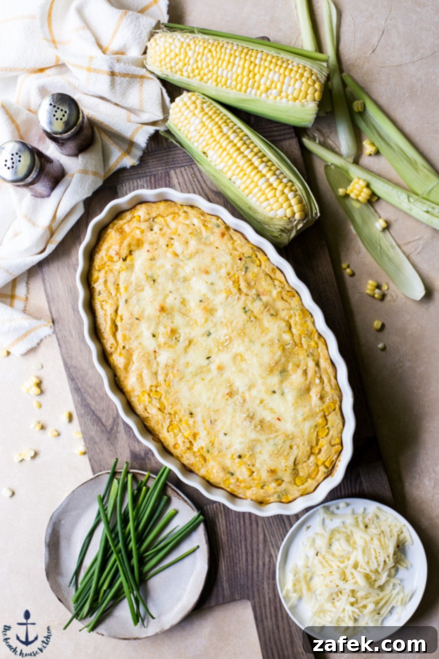 Overhead photo of Cheesy Corn Casserole with a few ears of corn