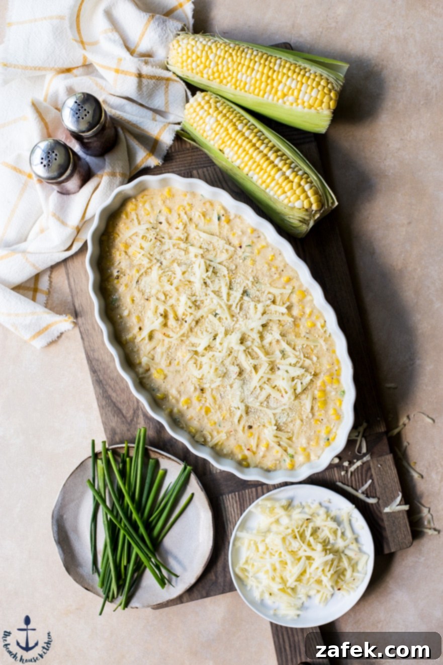 Overhead photo of Cheesy Corn Casserole with a few ears of corn
