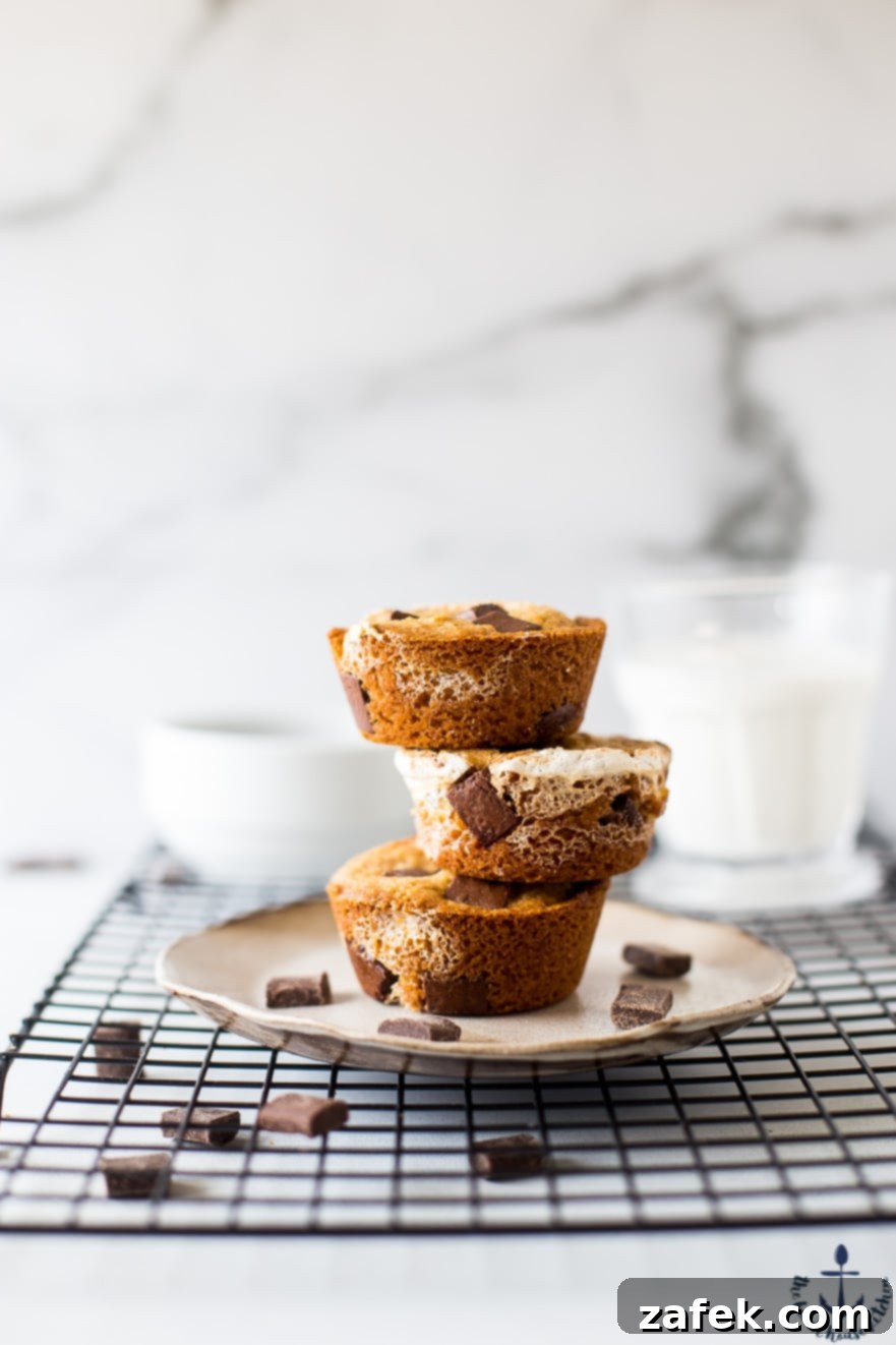 A beautifully presented stack of S'mores Cups, showcasing their golden brown tops and delicious fillings