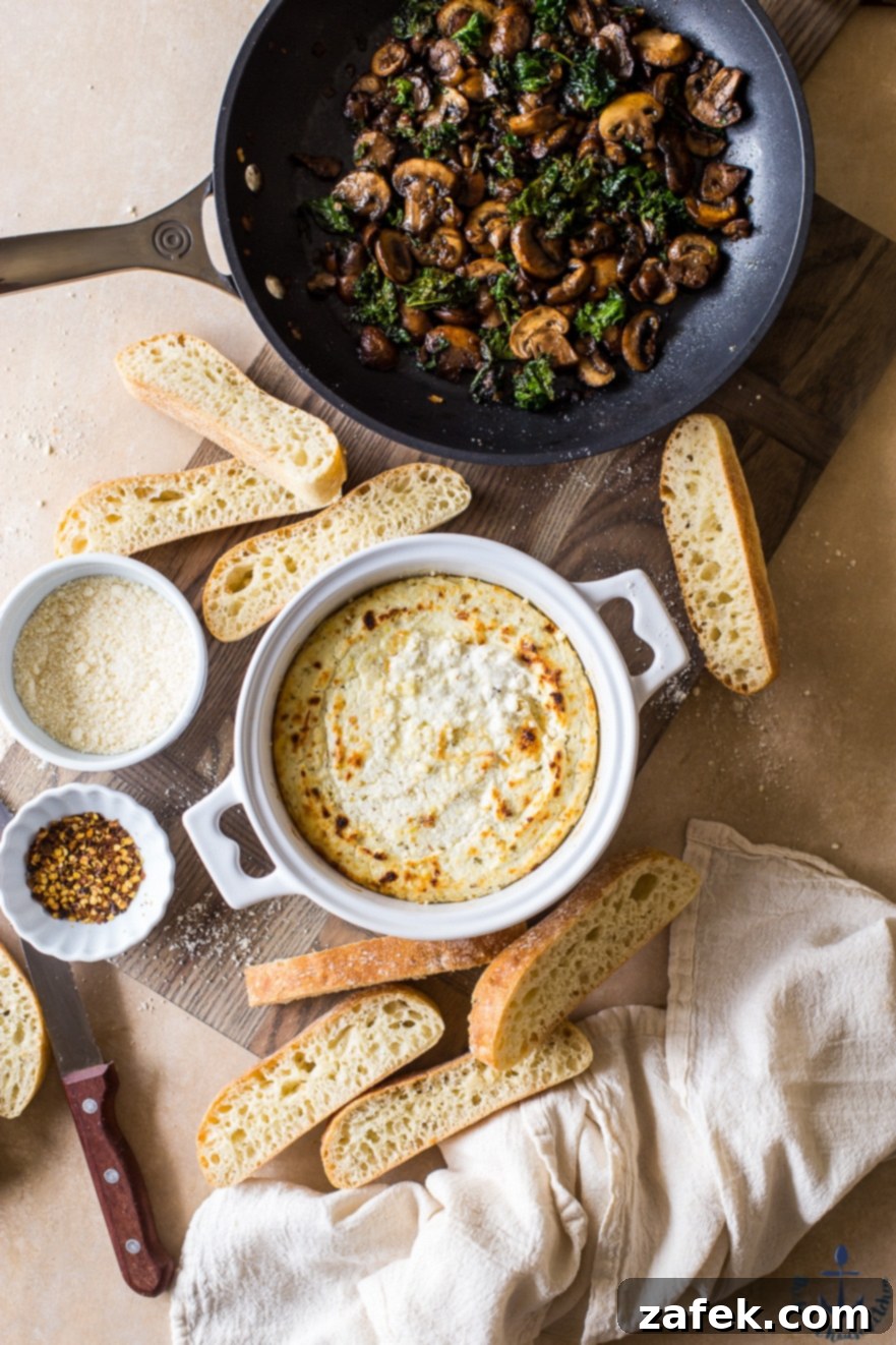 Savory Ricotta Custard with Sautéed Mushroom Shallot and Kale 2 Overhead photo of baked ricotta in white crock with mushroom, shallot and kale topping, ready to be served