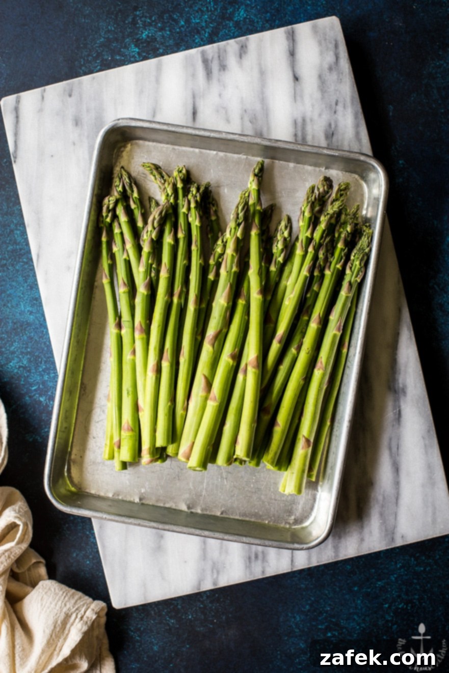 Overhead photo of asparagus on a silver tray