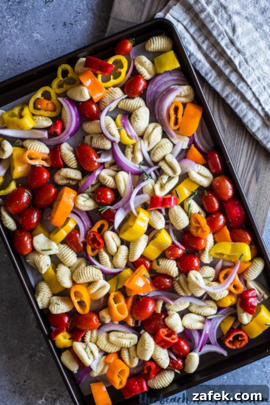 Golden Gnocchi and Veggies Sheet Pan Supper 5 Overhead photo of pre-baked sheet pan gnocchi and veggies