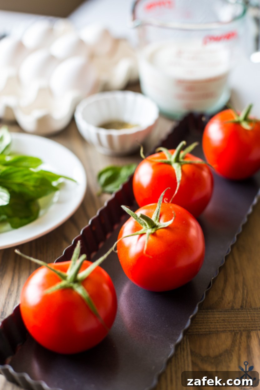 Close-up of the Tomato Basil Tart, showing the rich custard and tomato slices.