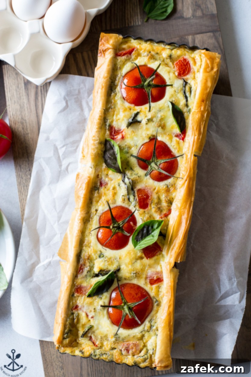 The final baked Tomato Basil Tart, cut into wedges, ready to be enjoyed.